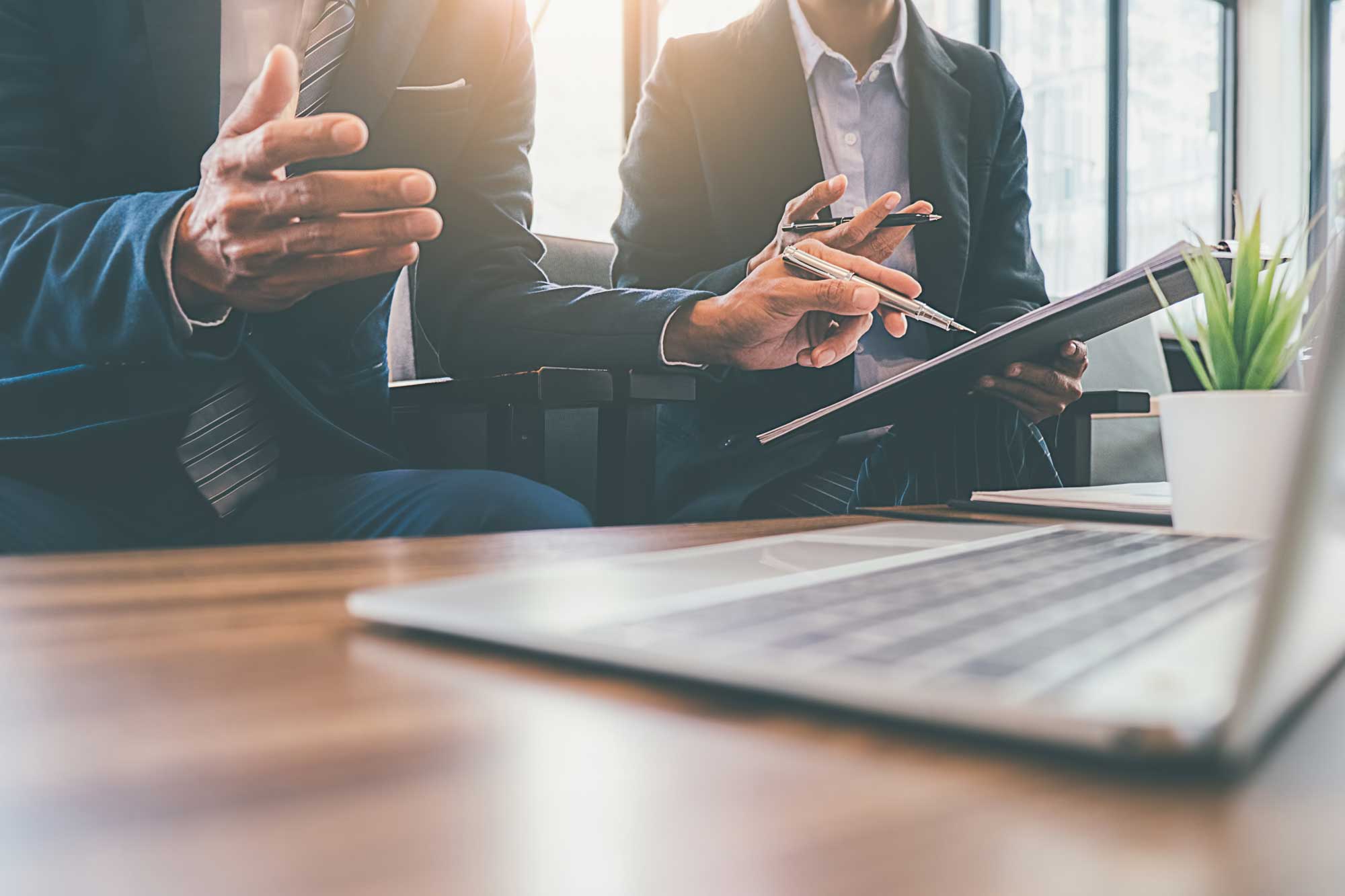 Financial professionals looking at computer